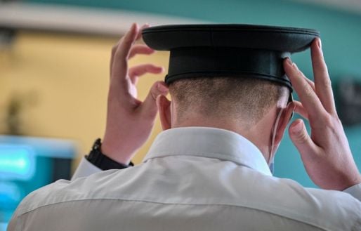 Student Officer putting on hat