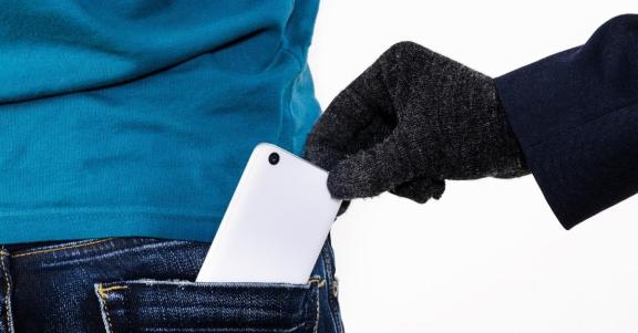 Mobile phone being taken out of a back pocket