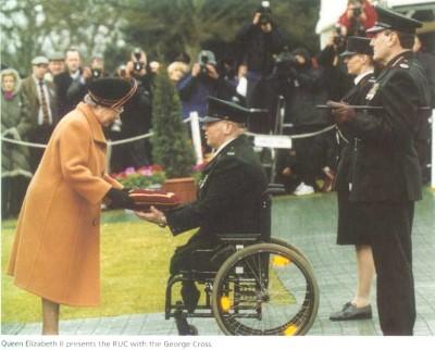 Queen Elizabeth II presents the Royal Ulster Constabulary (RUC) with the George Cross