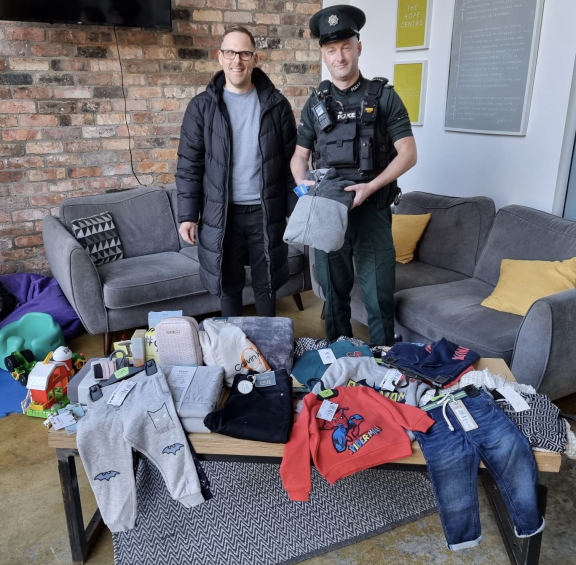 Foyleside & The Moor Constable John Bannon with John Loughery, on behalf of Cornerstone City Church, and some of the goods being donated.  