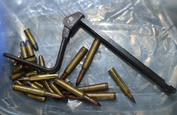 Assorted rounds of ammunition and firearm stock