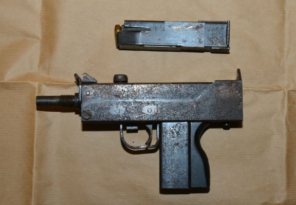 Pictured is a firearm and magazine.