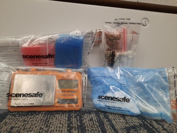 Photograph of seized drugs and paraphernalia