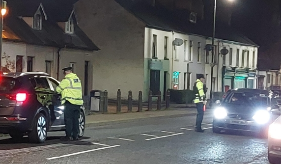 Officers speak with drivers during the road safety operation