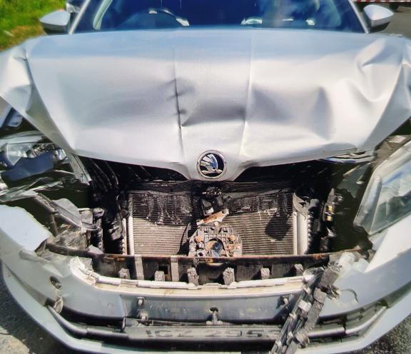 The damaged police vehicle.