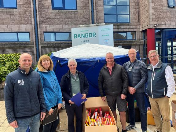 Greg Yarnall, RYA NI chief executive, Jackie Patton and Rob Totten, RYA NI, Cruising and Environmental Committee members with Constables Phil Wilkinson and Andy Russell with Kevin Baird from Bangor Marina with some of the flares received.