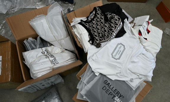 Boxes of counterfeit designer-look clothing.