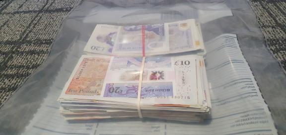 A sum of  money seized by detectives from the Police Service of Northern Ireland’s Organised Crime Unit on Tuesday 24th September