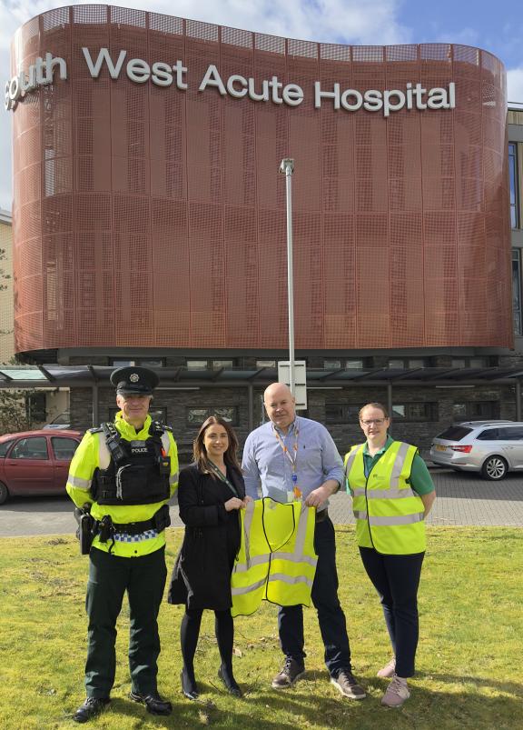 Pictured from left to right are: Inspector Gary Irvine, Sgt Lauren McFarland, presenting high viz vests to Professor Ronan O’Hare, Deputy Medical Director, Western Trust and Gemma Leonard, Support Services, South West Acute Hospital, Enniskillen.