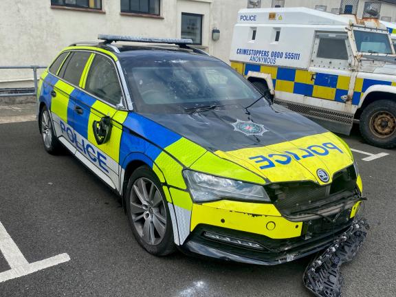 One of the police vehicles damaged in Monday night's disorder.