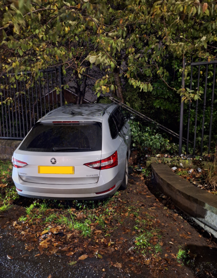 Pictured is the police vehicle, which was rammed off the road and through a fence.