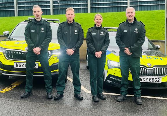 D District Commander Superintendent Lynne Corbett and team with two of the cars taking part in the pilot