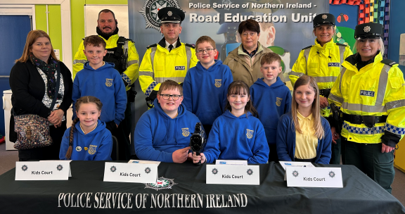 Judges from the Kids' Court at Artigarvan PS with police officers and PCSP following their session. 